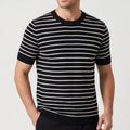 Black cotton shirt on an off-gray studio background