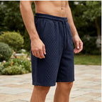 Model wearing Navy Blue 2026 Summer Jacquard Texture Sports Shorts, Trendy Casual Five-point Pants For Men outdoors - 3