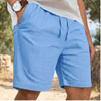 Model wearing Blue New Solid Linen Short Lightweight Gym Man Casual Pants Oversize Beach Hawaiian Baggy Pants Men Jogging Cotton Large Short Homme outdoors