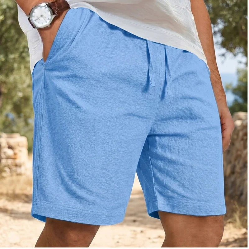 Model wearing Blue New Solid Linen Short Lightweight Gym Man Casual Pants Oversize Beach Hawaiian Baggy Pants Men Jogging Cotton Large Short Homme outdoors