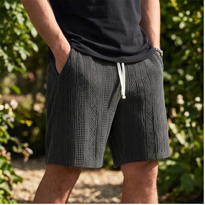 Model wearing Black 2026 New Men's Daily Jacquard Textured Fashion Casual Shorts outdoors