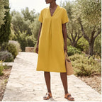 Model wearing Yellow Women's Short-sleeved Cotton and Linen Dress V-neck Loose Large Size Casual Vacation Street Long Dress with Pockets outdoors