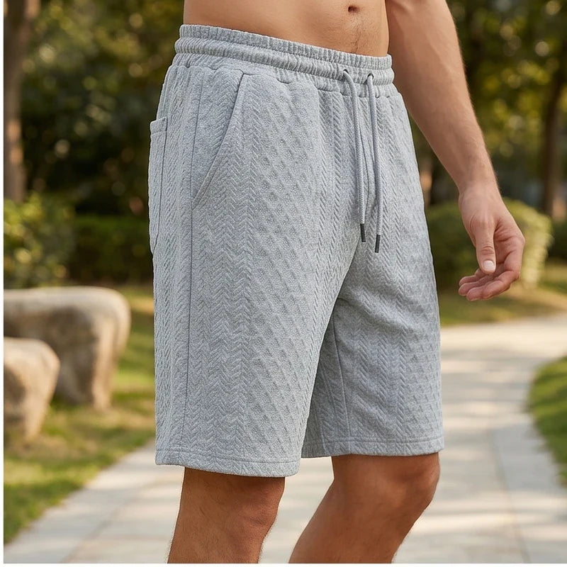 Model wearing Light Gray 2026 Summer Jacquard Texture Sports Shorts, Trendy Casual Five-point Pants For Men outdoors - 2