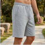 Model wearing Light Gray 2026 Summer Jacquard Texture Sports Shorts, Trendy Casual Five-point Pants For Men outdoors - 2