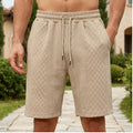Model wearing Khaki 2026 Summer Jacquard Texture Sports Shorts, Trendy Casual Five-point Pants For Men outdoors