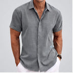 Model wearing Grey linen shirt in a studio