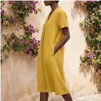 Model wearing Yellow Women's Short-sleeved Cotton and Linen Dress V-neck Loose Large Size Casual Vacation Street Long Dress with Pockets outdoors - 3