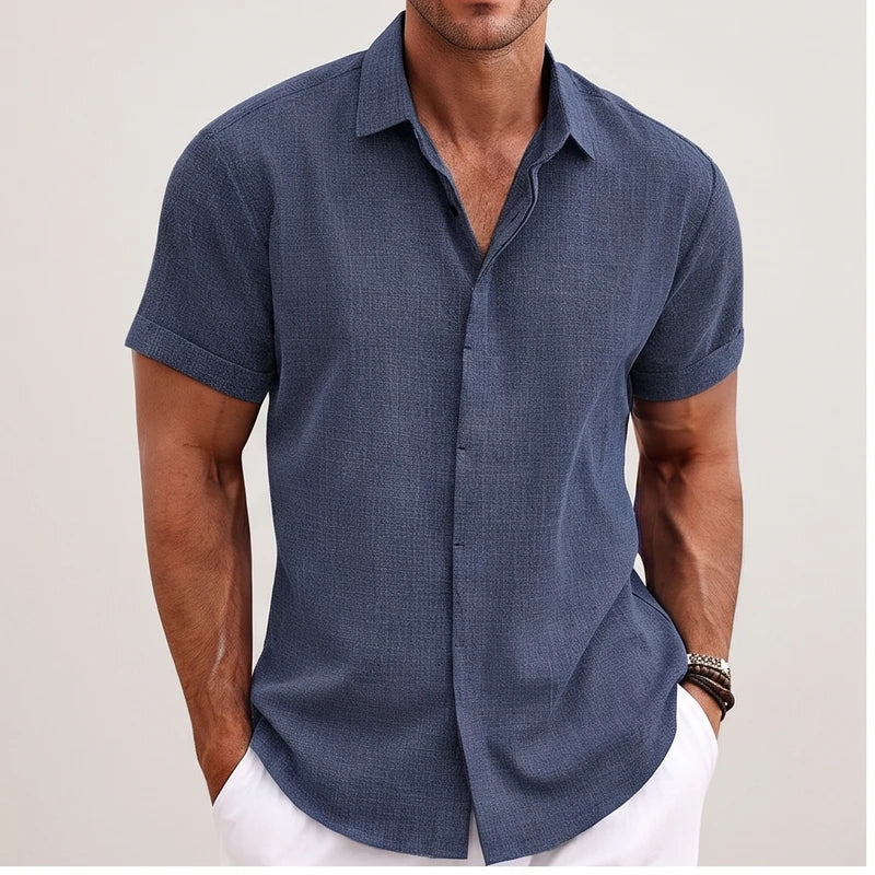 Model wearing Blue linen shirt in a studio