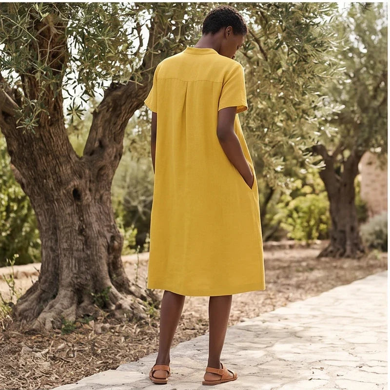 Model wearing Yellow Women's Short-sleeved Cotton and Linen Dress V-neck Loose Large Size Casual Vacation Street Long Dress with Pockets outdoors - 2