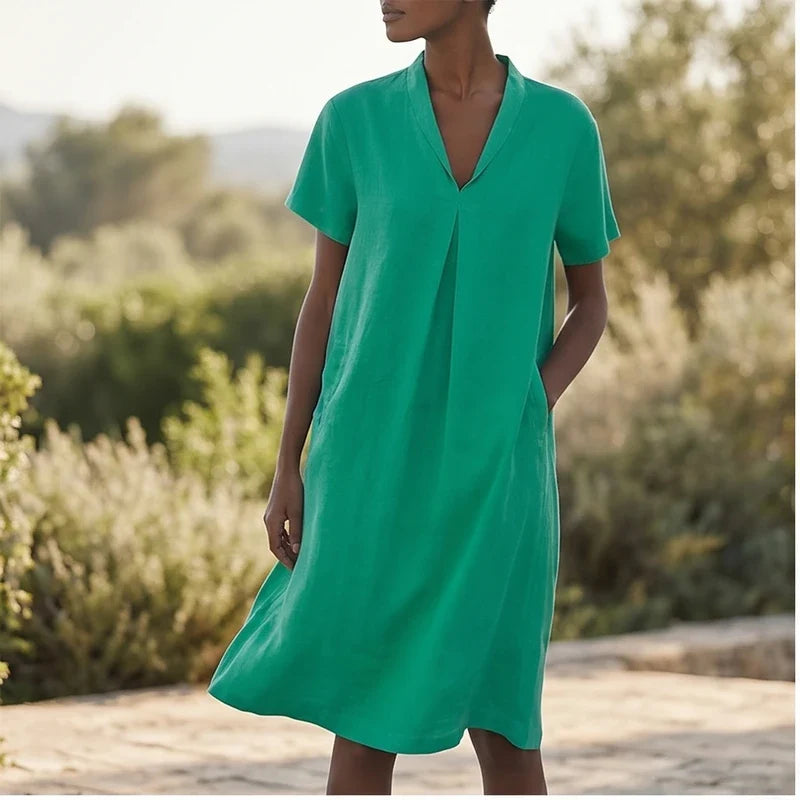 Model wearing Green Women's Short-sleeved Cotton and Linen Dress V-neck Loose Large Size Casual Vacation Street Long Dress with Pockets outdoors