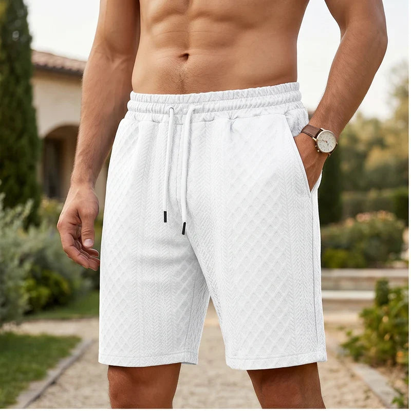 Model wearing White 2026 Summer Jacquard Texture Sports Shorts, Trendy Casual Five-point Pants For Men outdoors