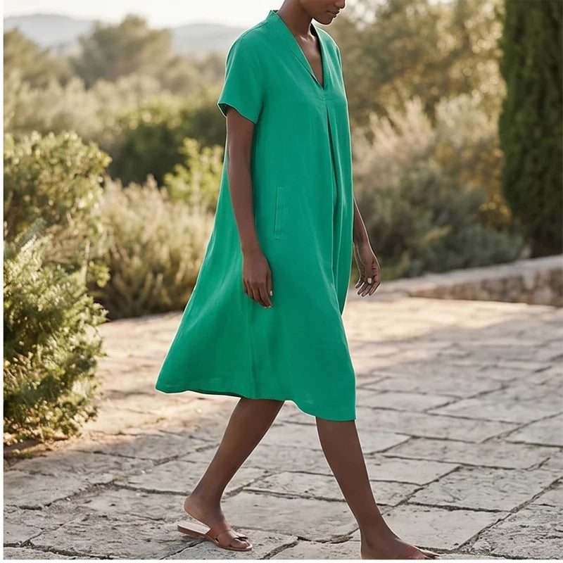 Model wearing Green Women's Short-sleeved Cotton and Linen Dress V-neck Loose Large Size Casual Vacation Street Long Dress with Pockets outdoors - 2