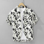 Short-sleeve shirt with black abstract pattern on a gray background
