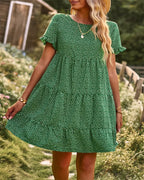Green dotted mini A-line sundress with ruffled short sleeves.