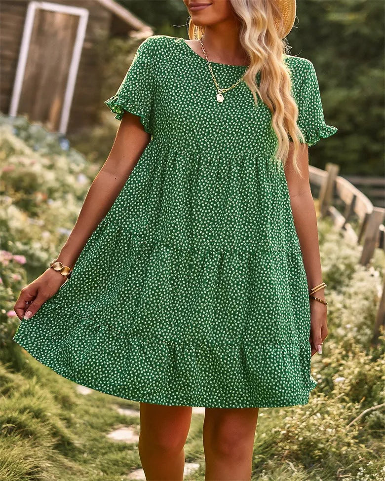 Green dotted mini A-line sundress with ruffled short sleeves.