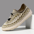Olive green woven waterproof sneakers with tan sole and rope lacing.