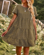 Green dotted mini A-line sundress with short sleeves.