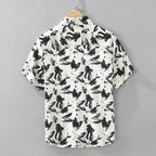 White shirt with black abstract pattern on a gray background