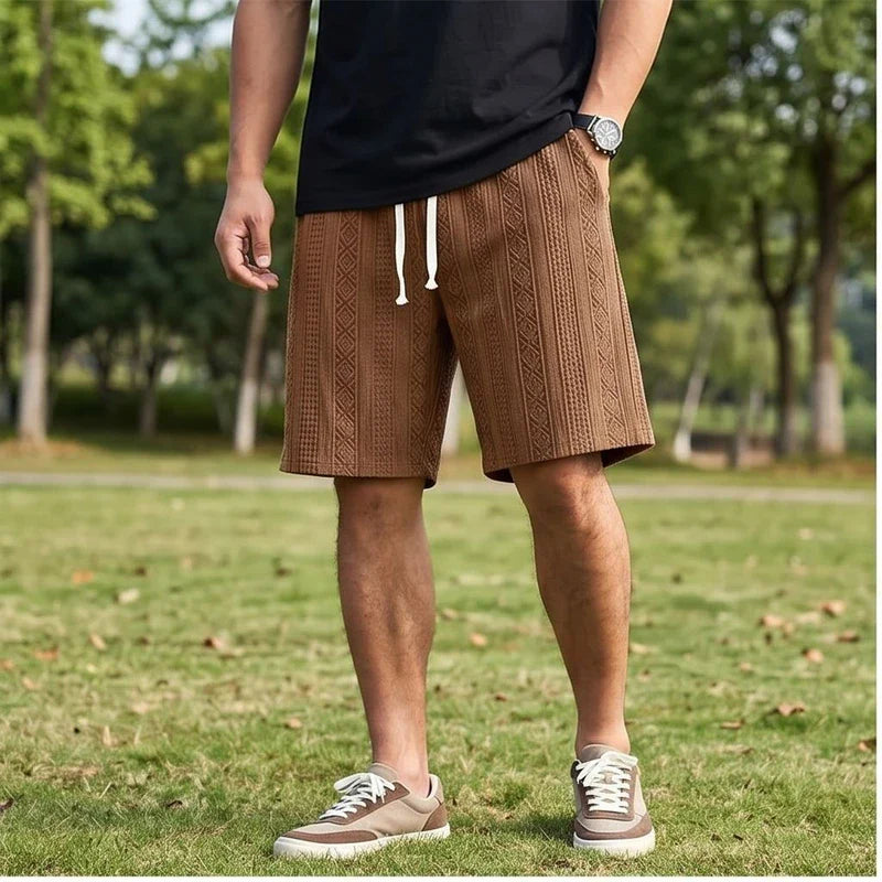 Model wearing Brown 2026 New Men's Daily Jacquard Textured Fashion Casual Shorts outdoors