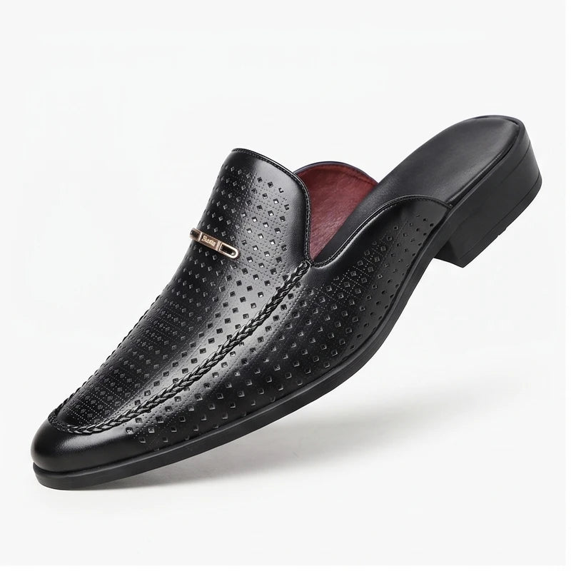 Black leather mules on a white background