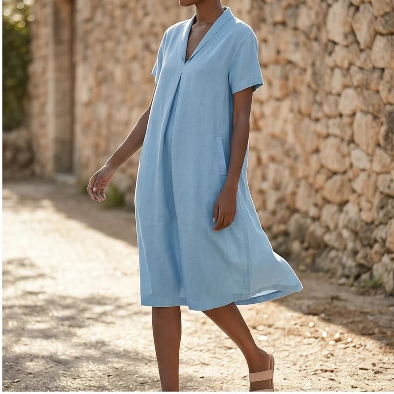 Model wearing Blue Women's Short-sleeved Cotton and Linen Dress V-neck Loose Large Size Casual Vacation Street Long Dress with Pockets outdoors - 2
