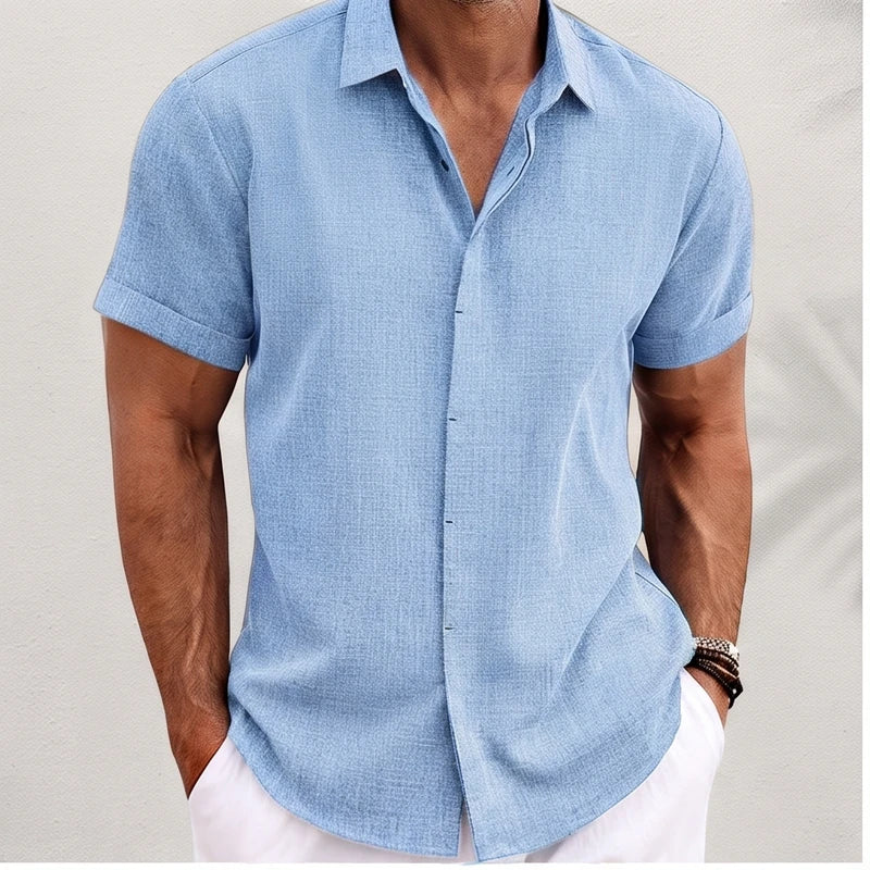 Model wearing Light Blue linen shirt in a studio