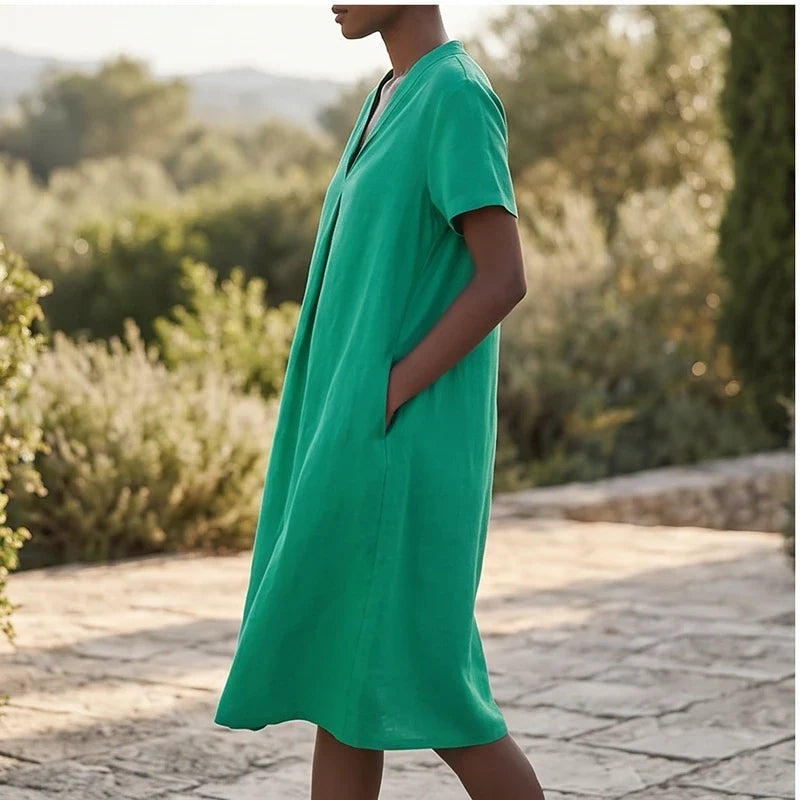 Model wearing Green Women's Short-sleeved Cotton and Linen Dress V-neck Loose Large Size Casual Vacation Street Long Dress with Pockets outdoors - 3