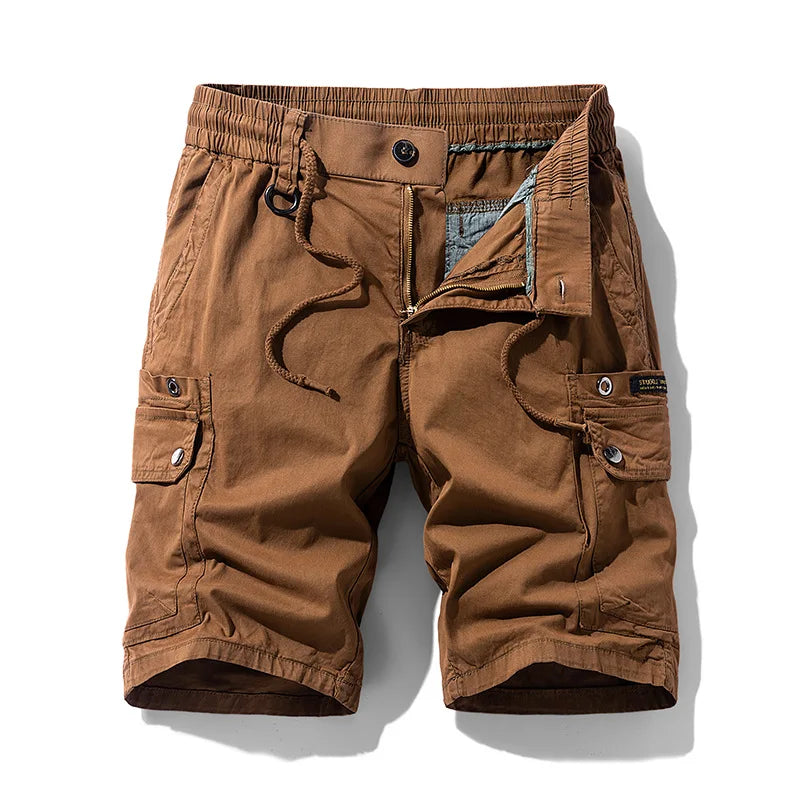 Flat lay of brown cargo shorts with an elastic waistband, drawstring, unzipped fly, and multiple button-flap pockets.