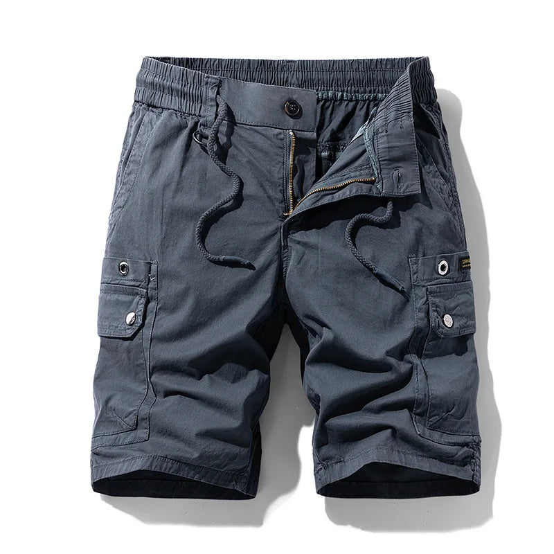 Dark grey cotton cargo shorts with an elastic drawstring waist, unzipped fly, and two flap cargo pockets with snaps.