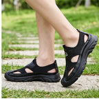 Model wearing Black Cassian Genuine Leather Sport Sandals outdoors - 2