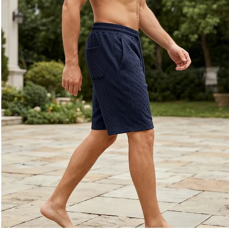 Model wearing Navy Blue 2026 Summer Jacquard Texture Sports Shorts, Trendy Casual Five-point Pants For Men outdoors - 2