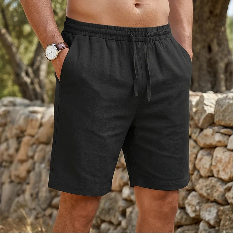 Model wearing Black New Solid Linen Short Lightweight Gym Man Casual Pants Oversize Beach Hawaiian Baggy Pants Men Jogging Cotton Large Short Homme outdoors