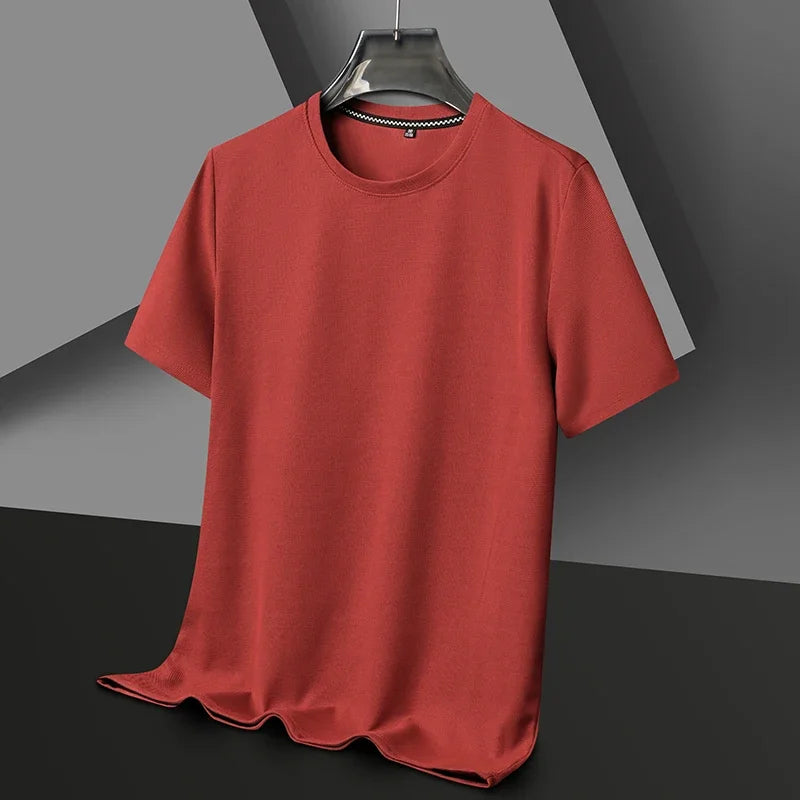 Terracotta short-sleeved knit crewneck shirt hanging on a hanger, featuring a subtle textured fabric and black trim inside the collar.