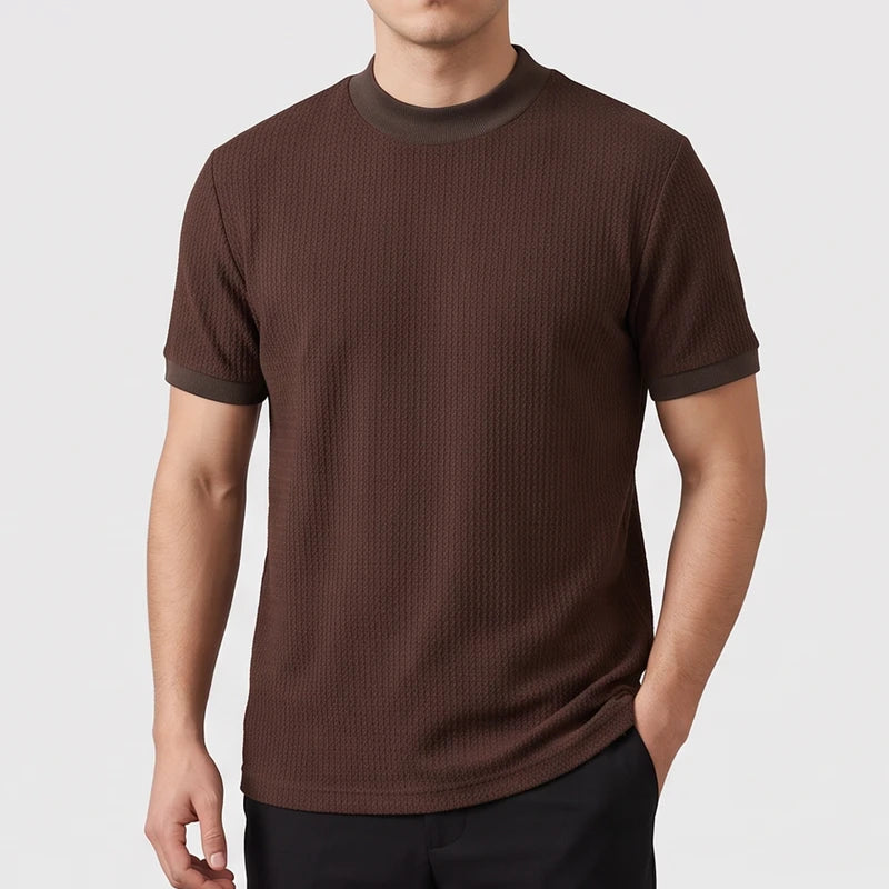 Brown knit shirt on an off-gray studio background