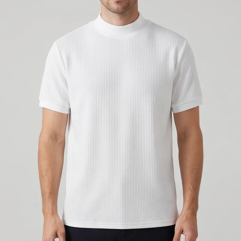White knit shirt on an off-gray studio background