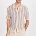 Man wearing a cream knit short sleeve button-up shirt with purple and brown vertical stripes.