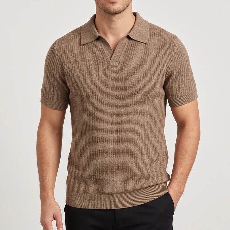 Man wearing a short-sleeve knit polo shirt in a textured brown, featuring a collared V-neck and ribbed hem.