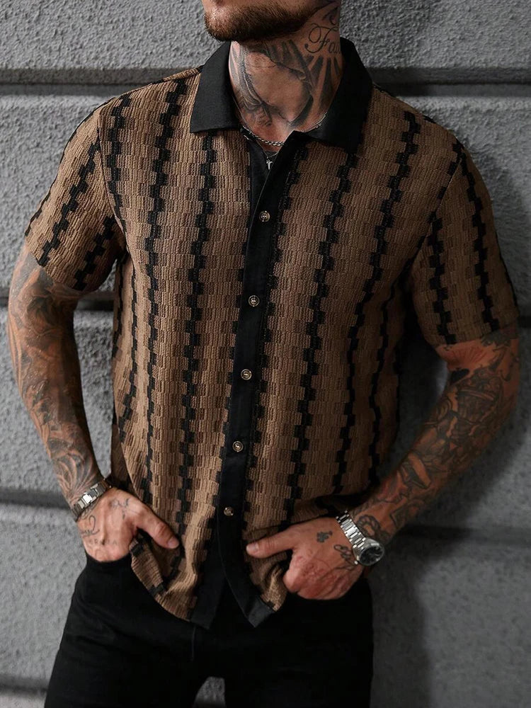 Man wearing a short-sleeve knit shirt with a black collar and front placket, featuring a brown and black textured pattern.