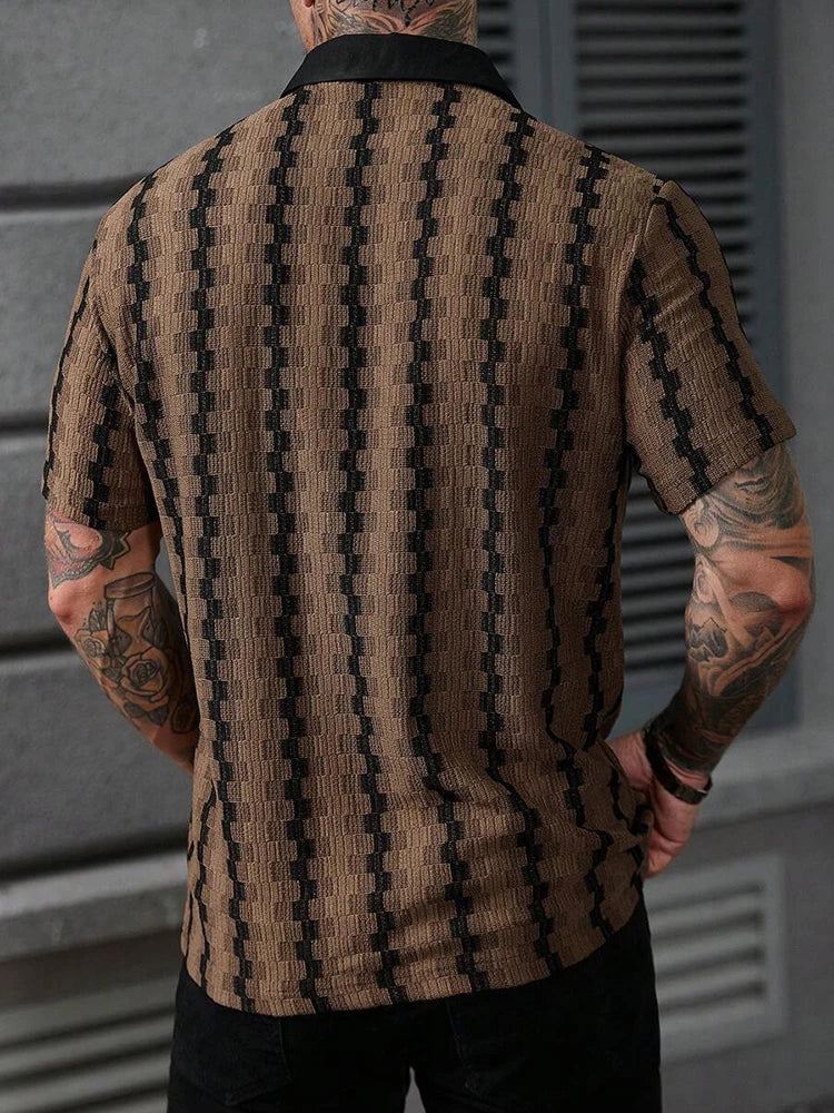 Man wearing a brown and black patterned knit short-sleeve shirt with a black collar, shown from the back.