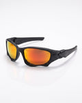 Matte black sports sunglasses with bright orange mirrored lenses, angled on a reflective white surface.