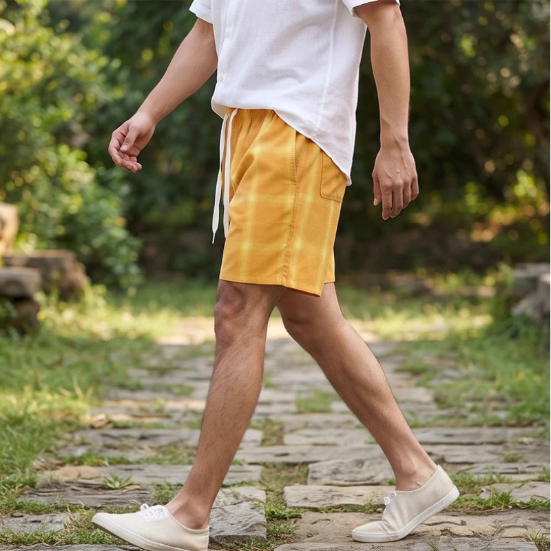 Model wearing Orange cotton shorts outdoors - 2
