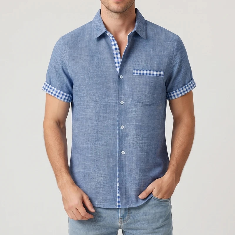 Blue shirt on an off-gray studio background