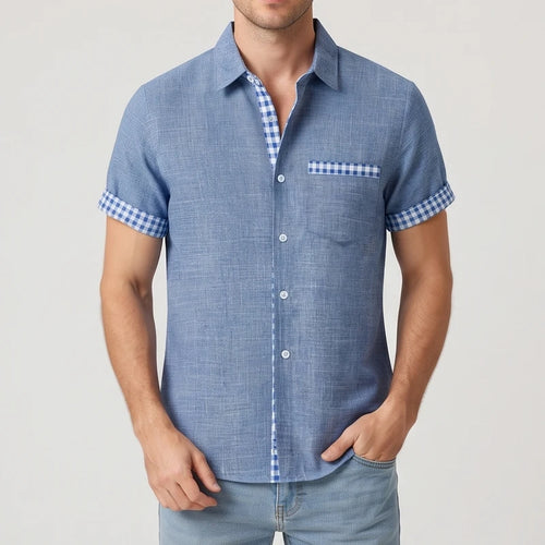 Blue shirt on an off-gray studio background