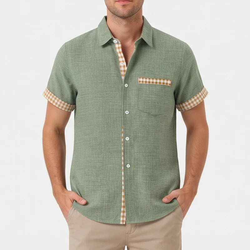 Green shirt on an off-gray studio background
