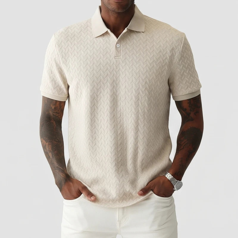 Beige polo on an off-gray studio background