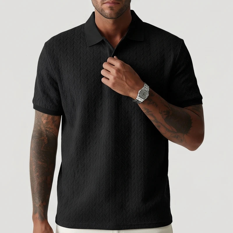 Black polo on an off-gray studio background - 2