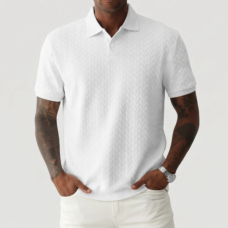White polo on an off-gray studio background
