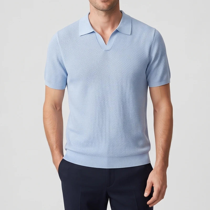 Blue knitted polo on an off-gray studio background - 2