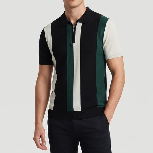 Man wearing a short-sleeved knitted polo shirt with black, cream, and green vertical stripes, featuring a silver quarter-zip.