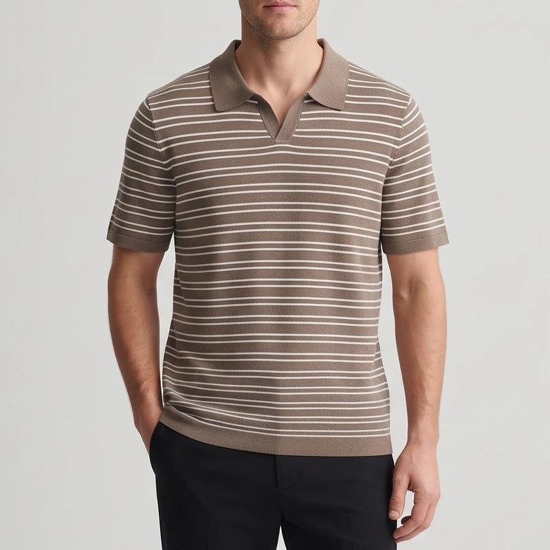 Man wearing a short-sleeve brown knit polo shirt with thin horizontal white stripes, hand in a black pant pocket.